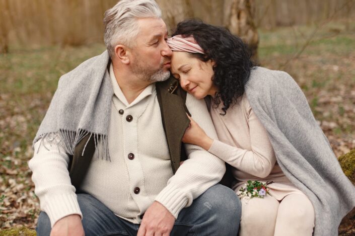 happy-senior-couple-hugging-in-autumn-park-