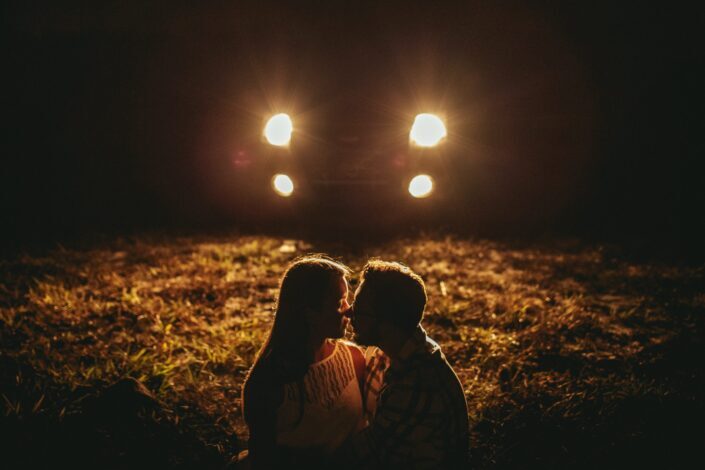 romantic-young-couple-cuddling-during-date-in-countryside-at-night-