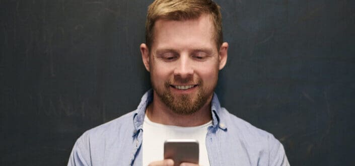 Photo of man using smartphone